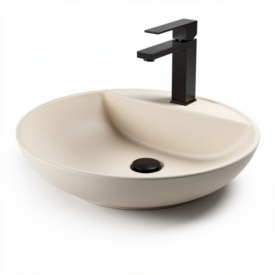 Ceramic vessel sink in cream color with black faucet for bathroom use